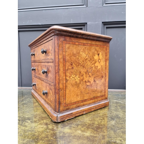 1062 - Miniature Furniture: a good Victorian walnut and marquetry three drawer chest, with ivory inset knob... 