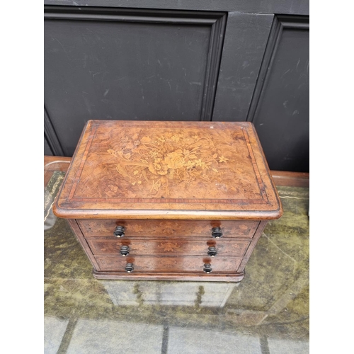 1062 - Miniature Furniture: a good Victorian walnut and marquetry three drawer chest, with ivory inset knob... 