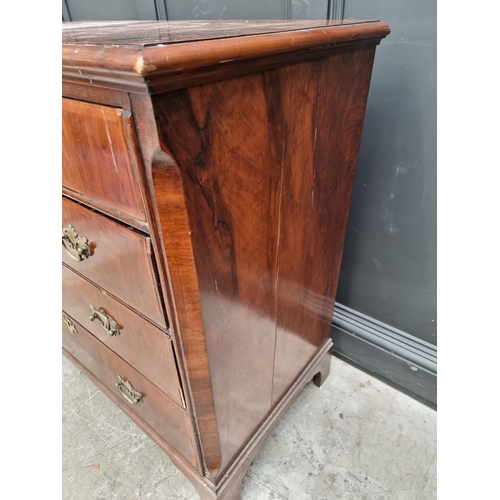 1065 - An 18th century walnut and feathered banded chest of drawers, 102cm wide. 