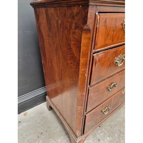 1065 - An 18th century walnut and feathered banded chest of drawers, 102cm wide. 