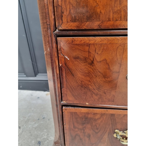 1065 - An 18th century walnut and feathered banded chest of drawers, 102cm wide. 