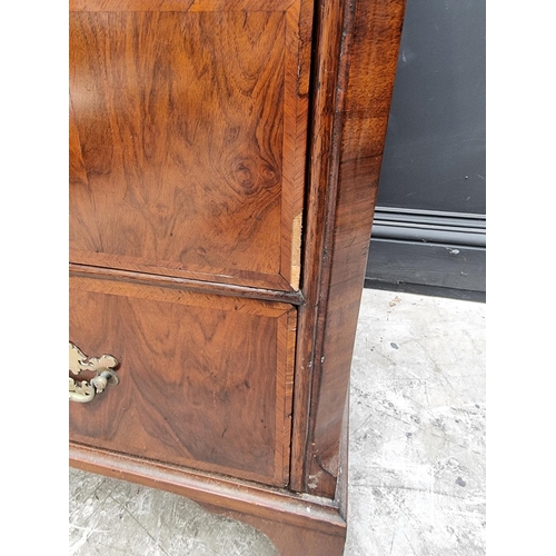 1065 - An 18th century walnut and feathered banded chest of drawers, 102cm wide. 