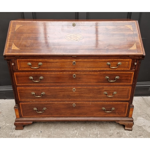 1066 - A George III mahogany and inlaid bureau, 117.5cm wide. 