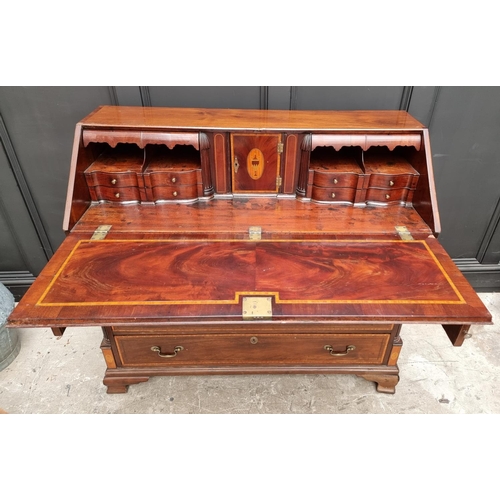 1066 - A George III mahogany and inlaid bureau, 117.5cm wide. 