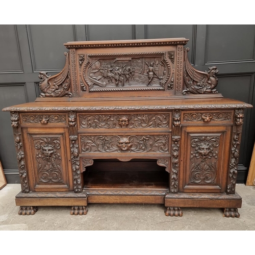 1067 - A large late Victorian carved oak side cabinet, 199cm wide.