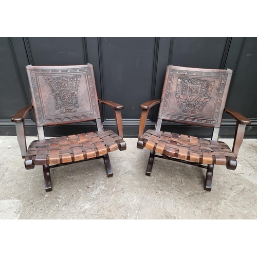 1071 - A pair of Ecuadorian hardwood and leather folding 'Inca' armchairs, by Angel Pazmino. (2) ... 