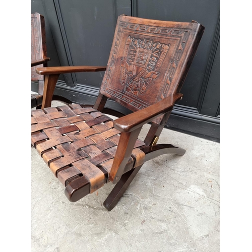 1071 - A pair of Ecuadorian hardwood and leather folding 'Inca' armchairs, by Angel Pazmino. (2) ... 