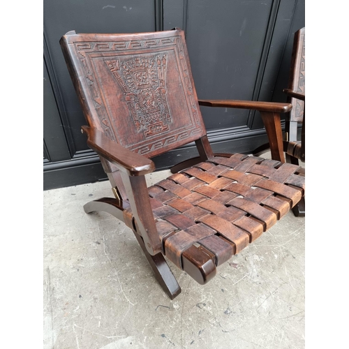 1071 - A pair of Ecuadorian hardwood and leather folding 'Inca' armchairs, by Angel Pazmino. (2) ... 