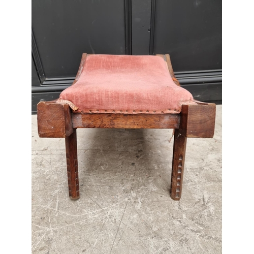 1072 - An unusual Victorian carved walnut saddle stool, initialled 'W R' and dated 1893, 55.5cm wide.&... 