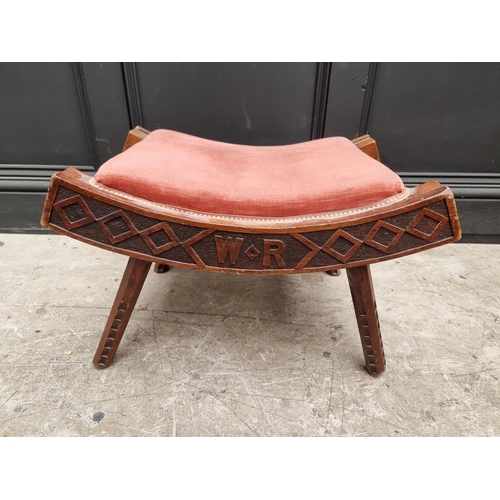 1072 - An unusual Victorian carved walnut saddle stool, initialled 'W R' and dated 1893, 55.5cm wide.&... 