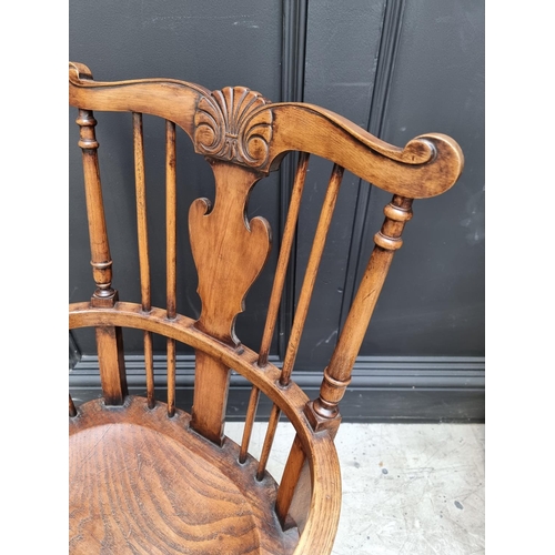 1074 - A small 18th century style ash, elm and beech Windsor armchair. 