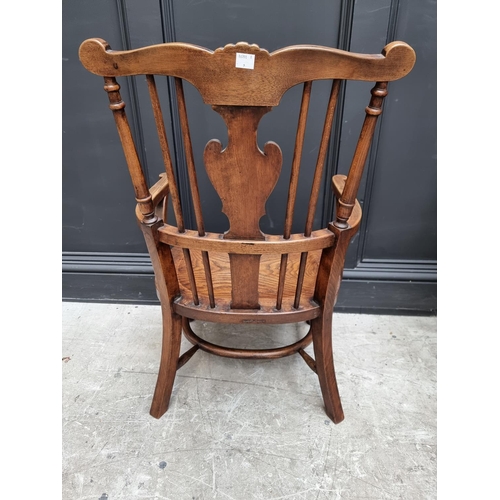 1074 - A small 18th century style ash, elm and beech Windsor armchair. 