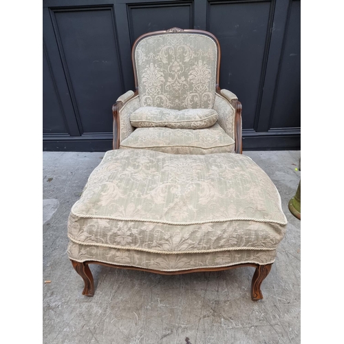 1076 - A beechwood and damask upholstered occasional armchair and matching stool. 