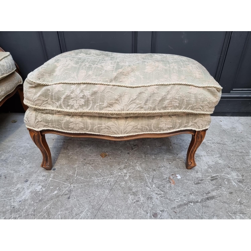 1076 - A beechwood and damask upholstered occasional armchair and matching stool. 