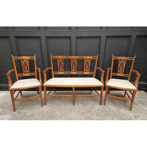 1081 - A late Victorian mahogany and inlaid salon settee and matching pair of elbow chairs. (3) ... 