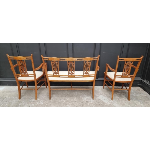 1081 - A late Victorian mahogany and inlaid salon settee and matching pair of elbow chairs. (3) ... 