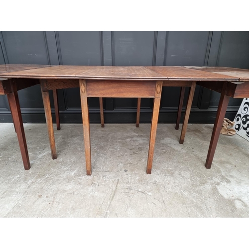 1087 - A George III mahogany and inlaid D end dining table, with dropleaf centre, 231cm extended.... 