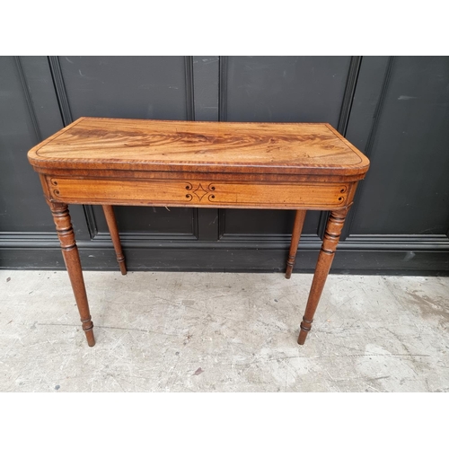 1089 - A Regency mahogany and line inlaid card table, with double gateleg, 91.5cm wide.  ... 