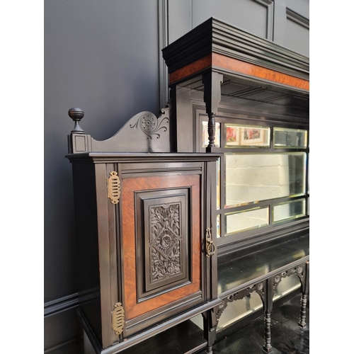 1098 - A large and impressive Aesthetic ebonized and amboyna mirror back side cabinet, 168.5cm wide.... 