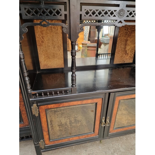 1098 - A large and impressive Aesthetic ebonized and amboyna mirror back side cabinet, 168.5cm wide.... 