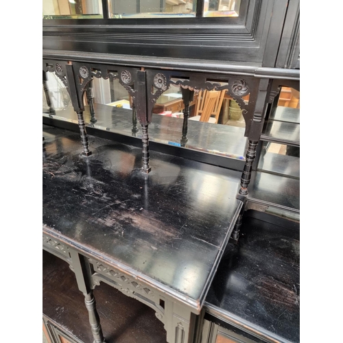 1098 - A large and impressive Aesthetic ebonized and amboyna mirror back side cabinet, 168.5cm wide.... 