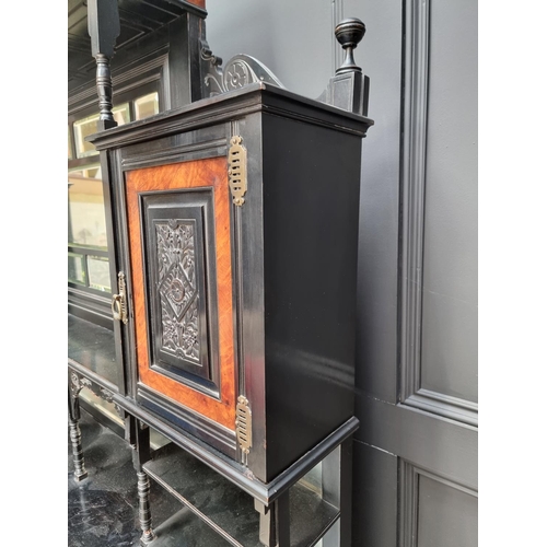 1098 - A large and impressive Aesthetic ebonized and amboyna mirror back side cabinet, 168.5cm wide.... 