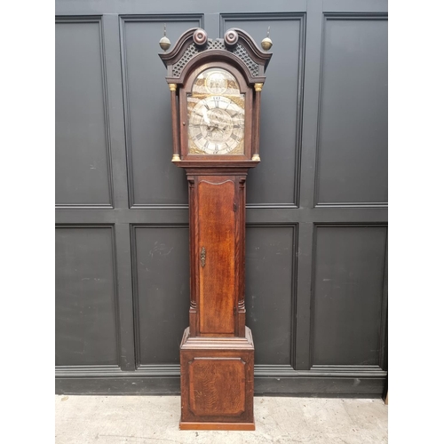 1100 - A George III oak and mahogany crossbanded eight day longcase clock, the 12in arched silvered dial in... 