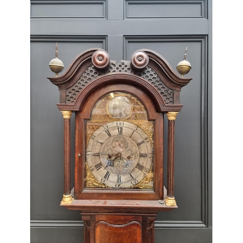 1100 - A George III oak and mahogany crossbanded eight day longcase clock, the 12in arched silvered dial in... 