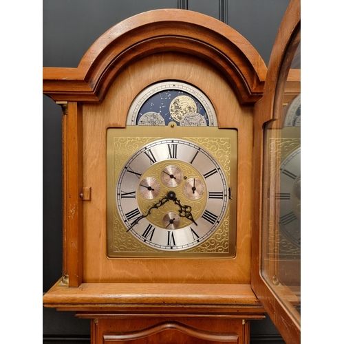 1101 - A small reproduction yew longcase clock, with moonphase arch, chiming on eight straight gongs, 195cm... 