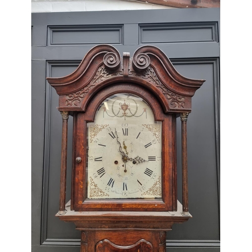 1103 - A George III oak and mahogany crossbanded eight day longcase clock, the 13in painted arched dial ins... 