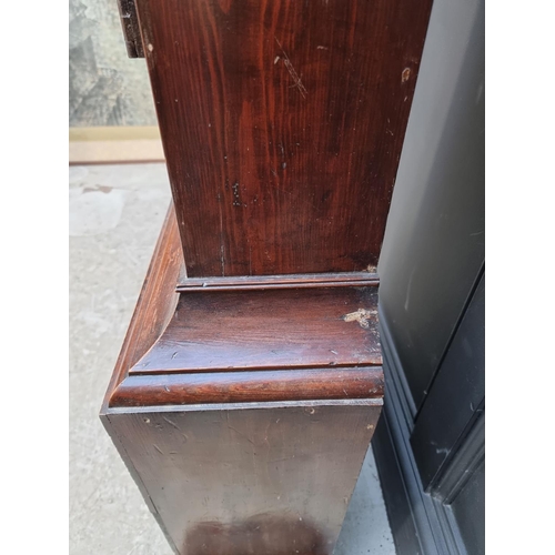 1105 - A George III stained oak and pine longcase clock, the 12in brass and silvered dial with rocking ship... 