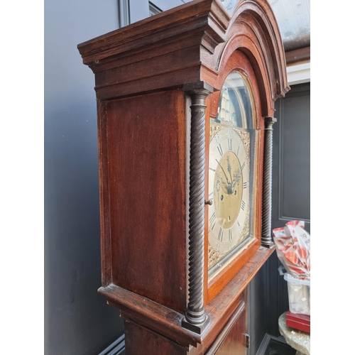 1105 - A George III stained oak and pine longcase clock, the 12in brass and silvered dial with rocking ship... 