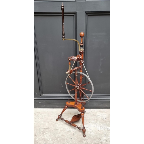 1117 - A good antique fruitwood and brass mounted spinning wheel, 118cm high.