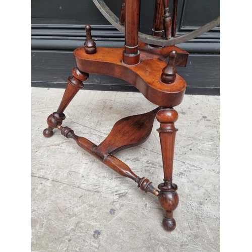 1117 - A good antique fruitwood and brass mounted spinning wheel, 118cm high.