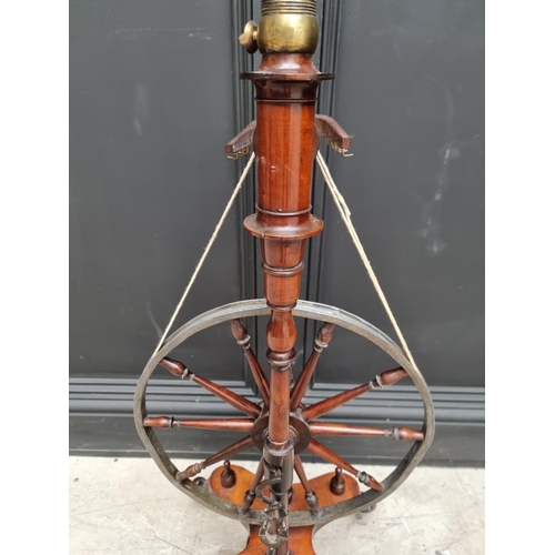 1117 - A good antique fruitwood and brass mounted spinning wheel, 118cm high.