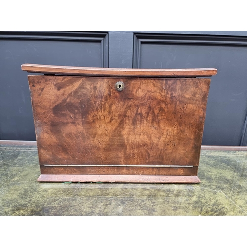 1120 - An elaborate early 20th century figured walnut desk box, 43cm wide. 