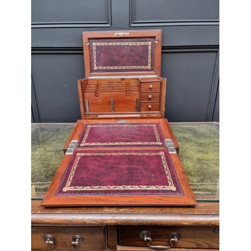 1120 - An elaborate early 20th century figured walnut desk box, 43cm wide. 