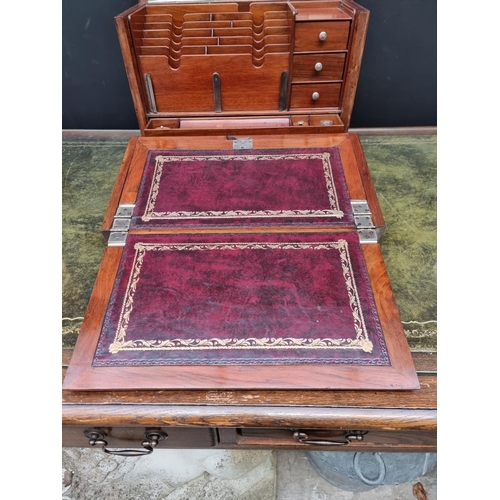 1120 - An elaborate early 20th century figured walnut desk box, 43cm wide. 