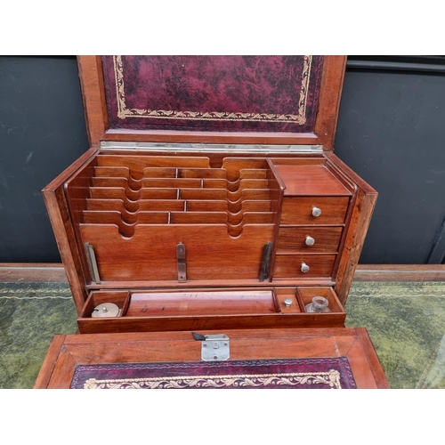 1120 - An elaborate early 20th century figured walnut desk box, 43cm wide. 