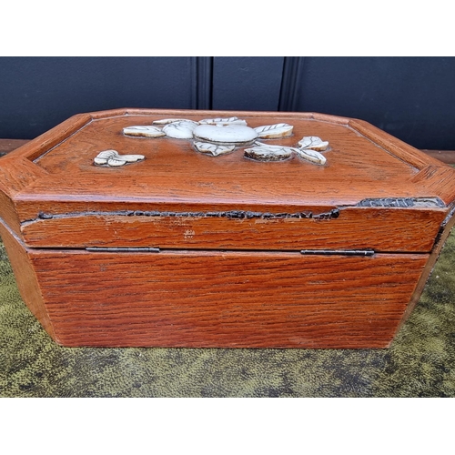 1121 - A Japanese elm and bone casket, of canted rectangular form, 23cm wide. 