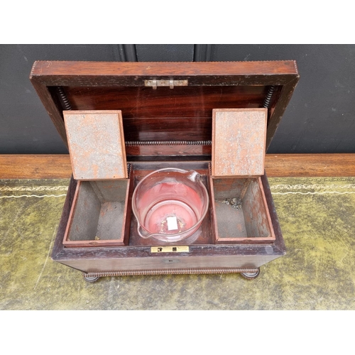 1124 - A Regency rosewood sarcophagus tea caddy, 31.5cm wide. 