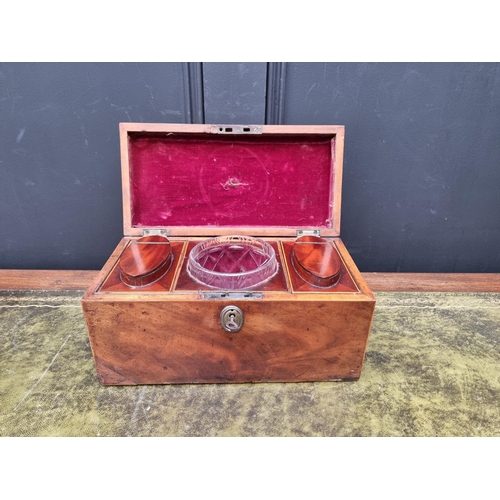 1127 - An early 19th century mahogany and line inlaid tea caddy, 30.5cm wide, with key.... 