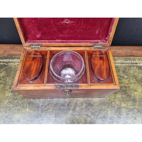 1127 - An early 19th century mahogany and line inlaid tea caddy, 30.5cm wide, with key.... 