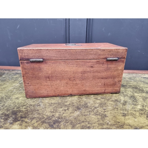 1127 - An early 19th century mahogany and line inlaid tea caddy, 30.5cm wide, with key.... 