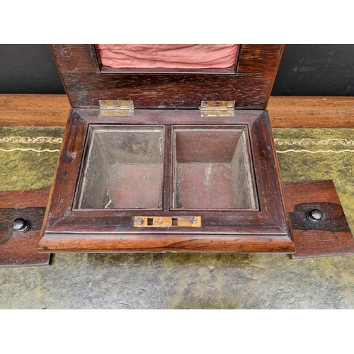 1128 - A Victorian rosewood bombe sarcophagus tea caddy, 25cm wide, (lacking feet).