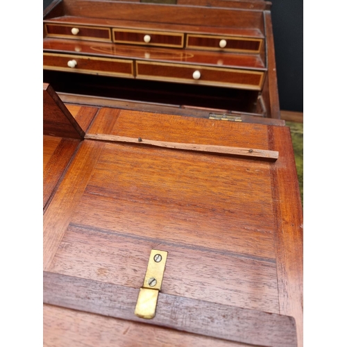 1136 - An unusual George III mahogany and inlaid writing slope, with bone knobs, 41cm wide.... 