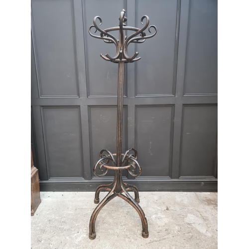 1138 - A large ebonized bentwood hat and coat stand, 209cm high.