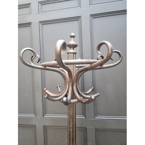 1138 - A large ebonized bentwood hat and coat stand, 209cm high.