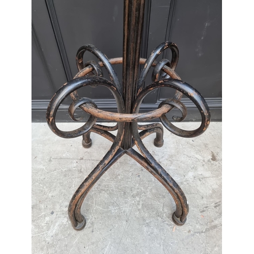 1138 - A large ebonized bentwood hat and coat stand, 209cm high.