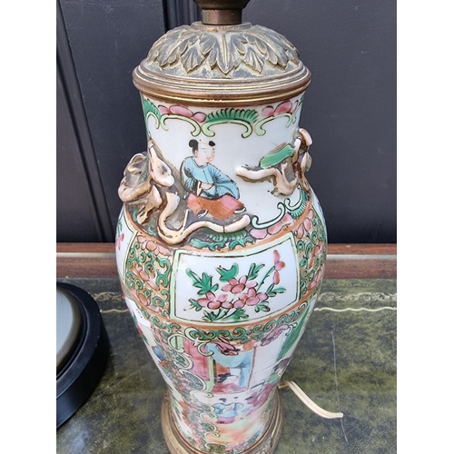 1280 - Two Chinese famille rose vase form table lamps, total height of largest 45cm, (each a.f.).... 